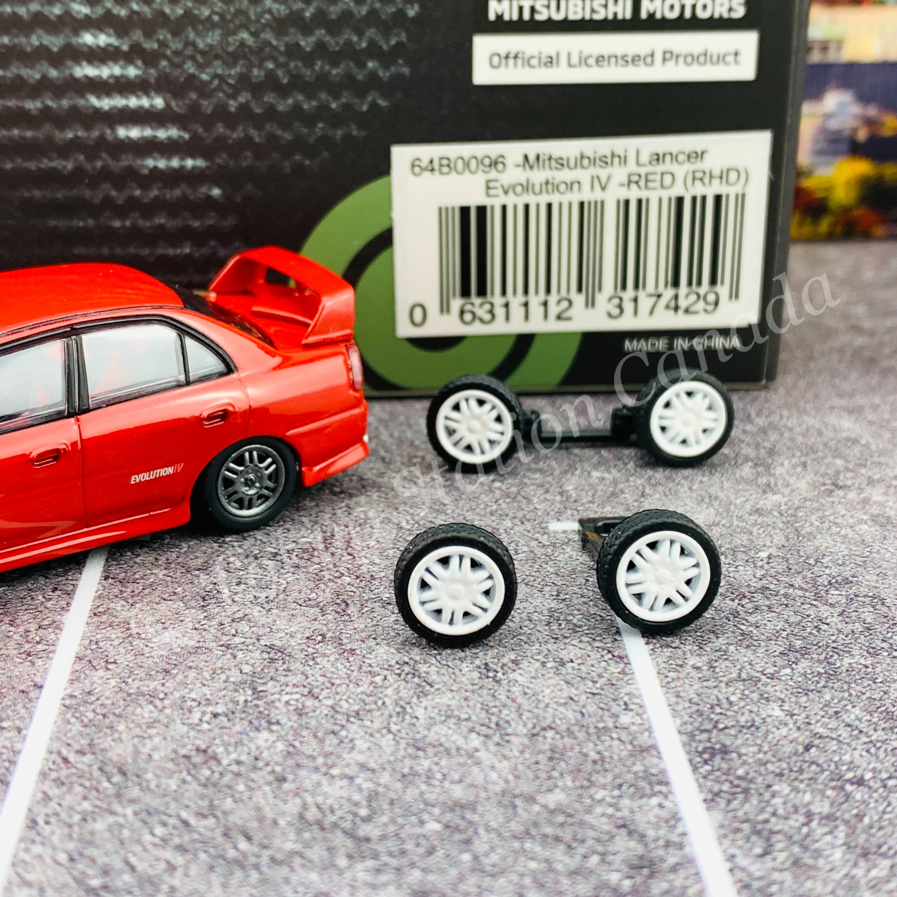 BM CREATIONS JUNIOR 1/64 Mitsubishi Lancer Evolution IV RED RHD with Extra Wheel Set 64B0096 - Image 2