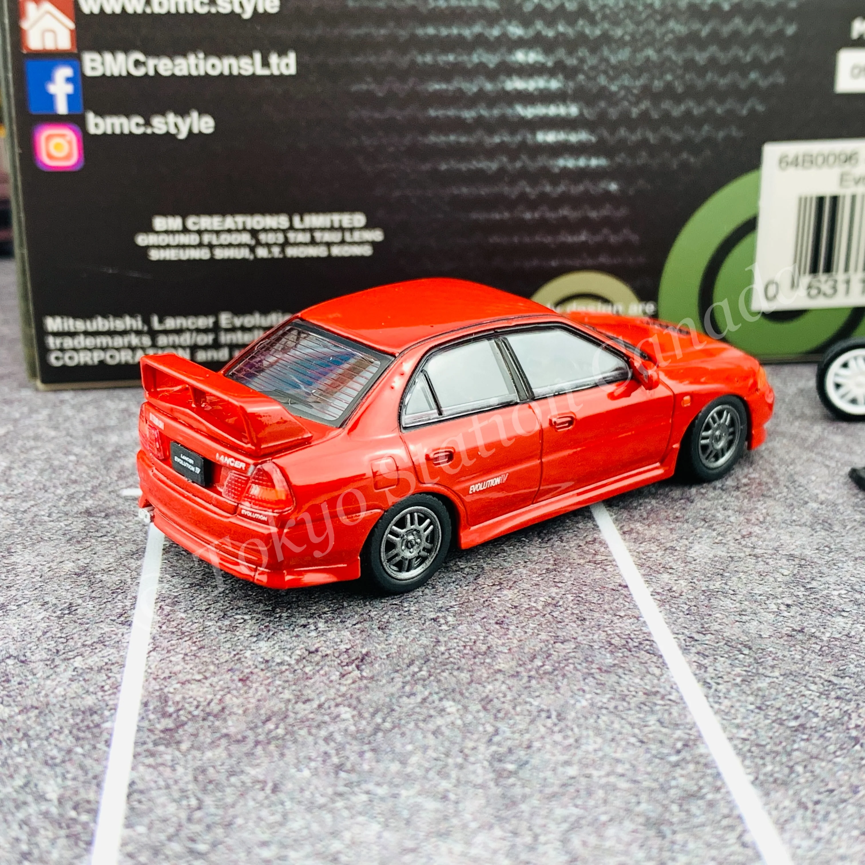 BM CREATIONS JUNIOR 1/64 Mitsubishi Lancer Evolution IV RED RHD with Extra Wheel Set 64B0096 - Image 3