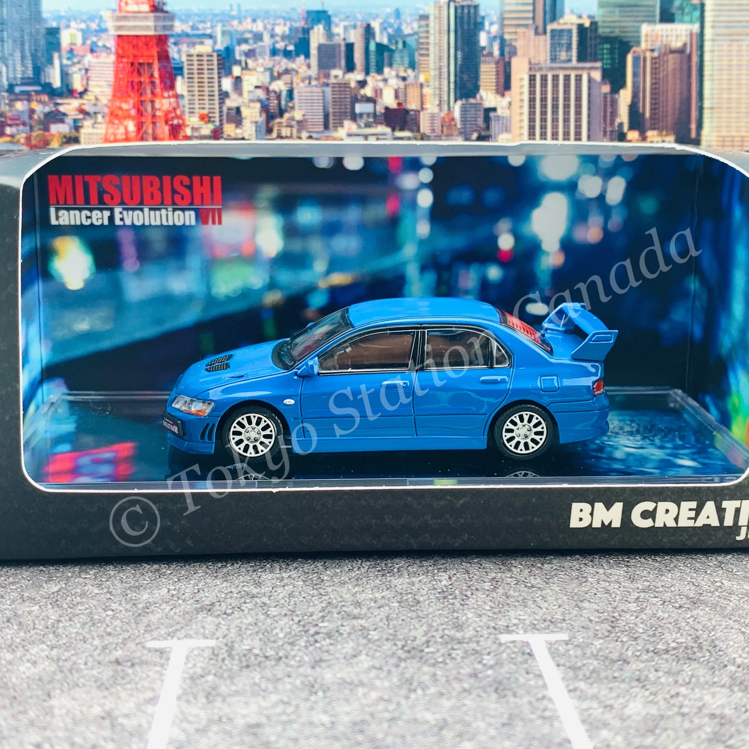 BM CREATIONS JUNIOR 1/64 Mitsubishi Lancer Evolution VII BLUE RHD with Extra Wheel Set and Lowering Parts 64B0088 - Image 2