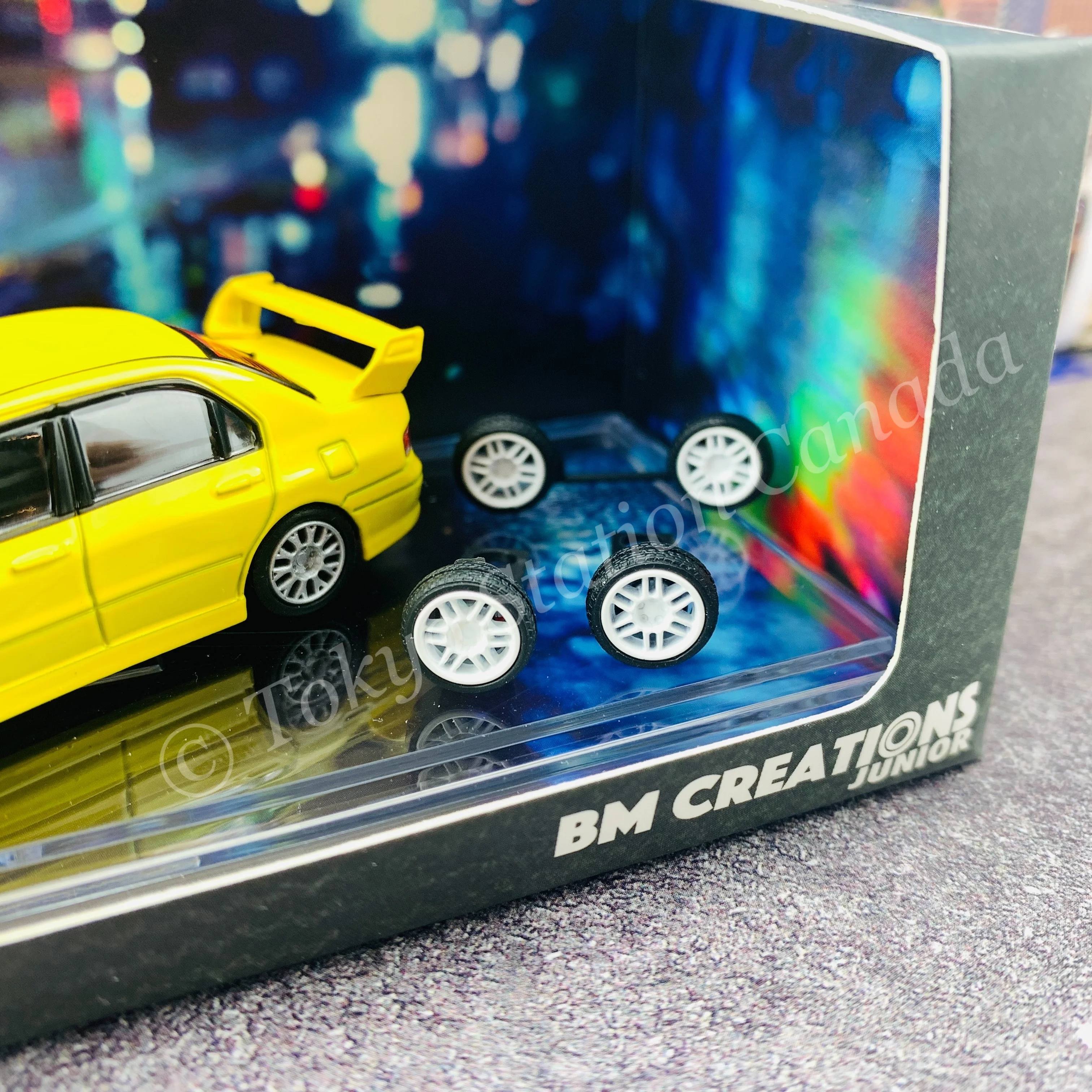 BM CREATIONS JUNIOR 1/64 Mitsubishi Lancer Evolution VII YELLOW RHD with Extra Wheel Set and Lowering Parts 64B0084 - Image 2