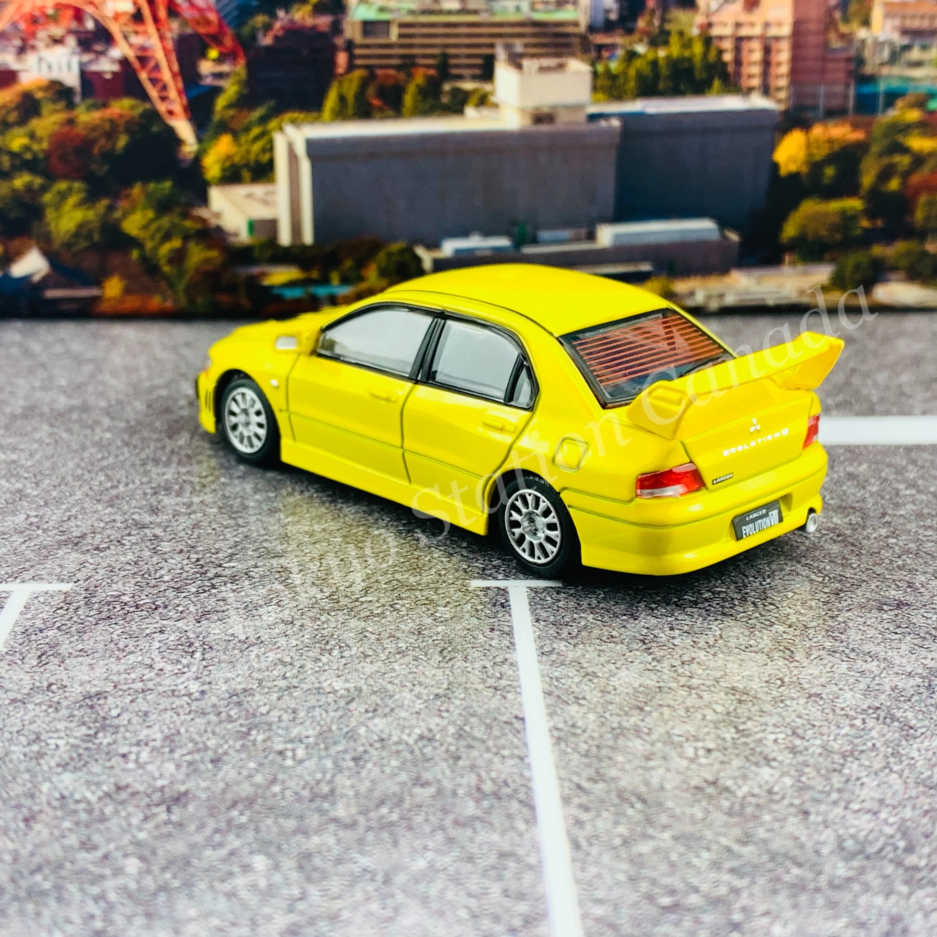 BM CREATIONS JUNIOR 1/64 Mitsubishi Lancer Evolution VII YELLOW RHD with Extra Wheel Set and Lowering Parts 64B0084 - Image 4