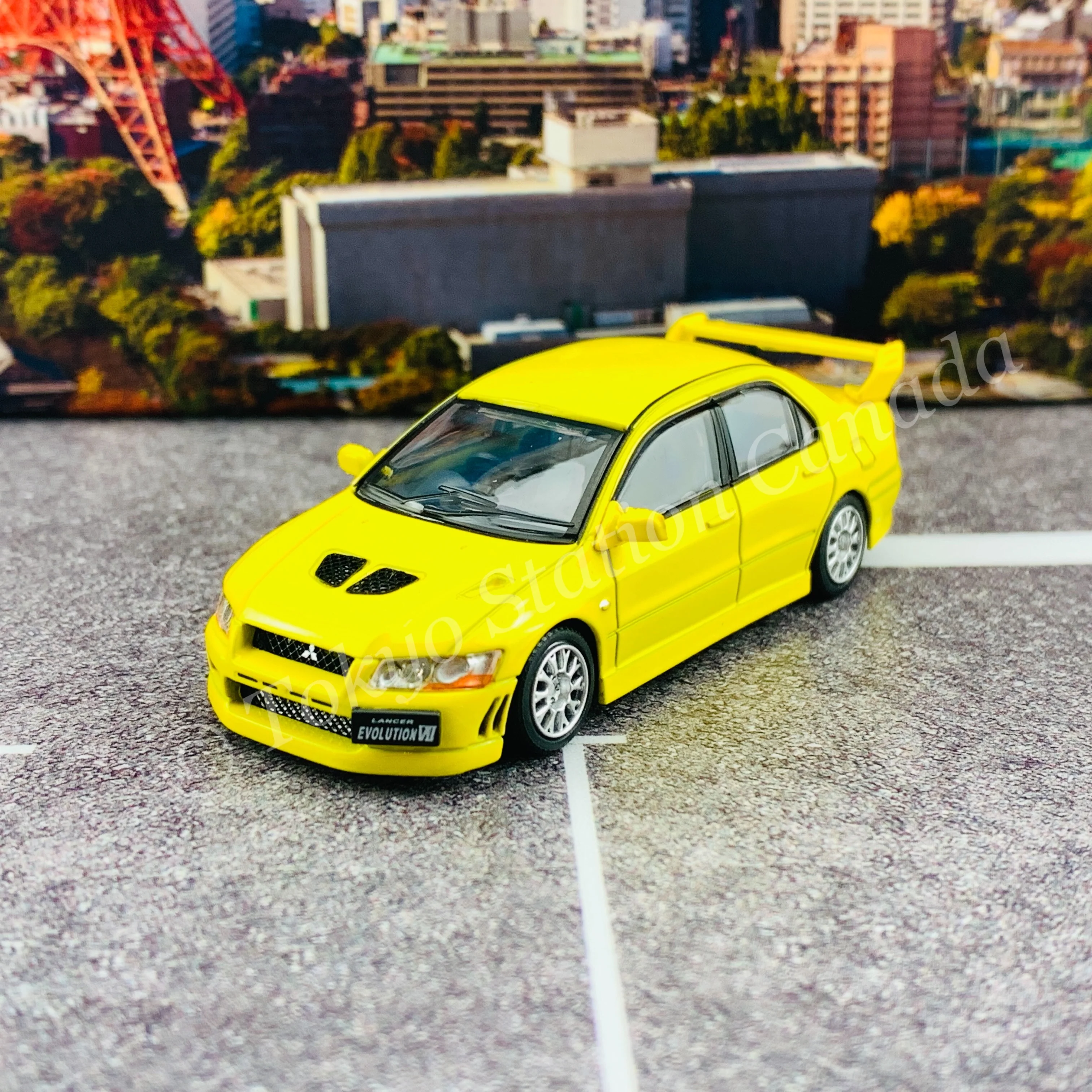 BM CREATIONS JUNIOR 1/64 Mitsubishi Lancer Evolution VII YELLOW RHD with Extra Wheel Set and Lowering Parts 64B0084 - Image 8