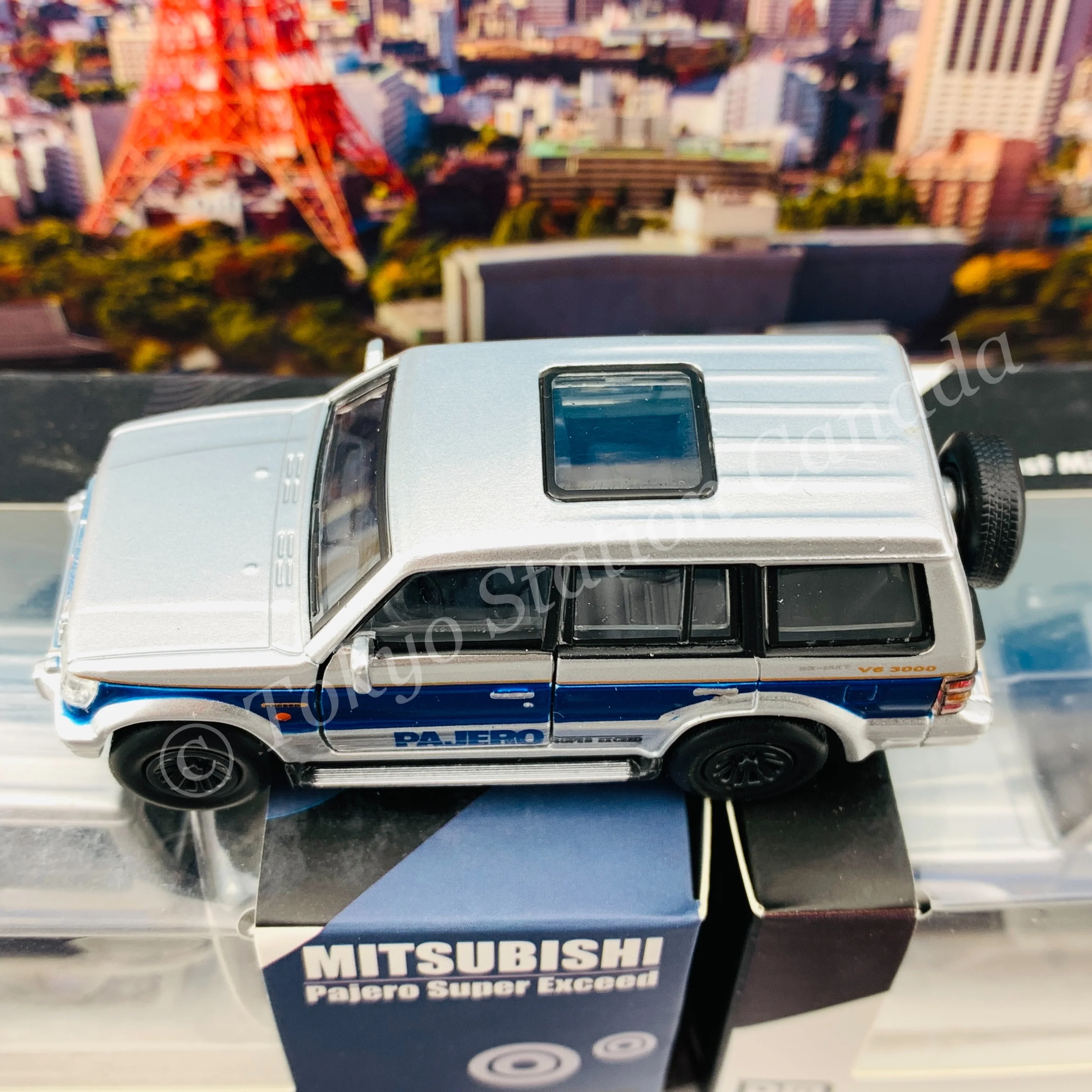 BM CREATIONS JUNIOR 1/64 Mitsubishi Pajero Super Exceed Silver with Blue Stripe LHD 64B0037 - Image 5