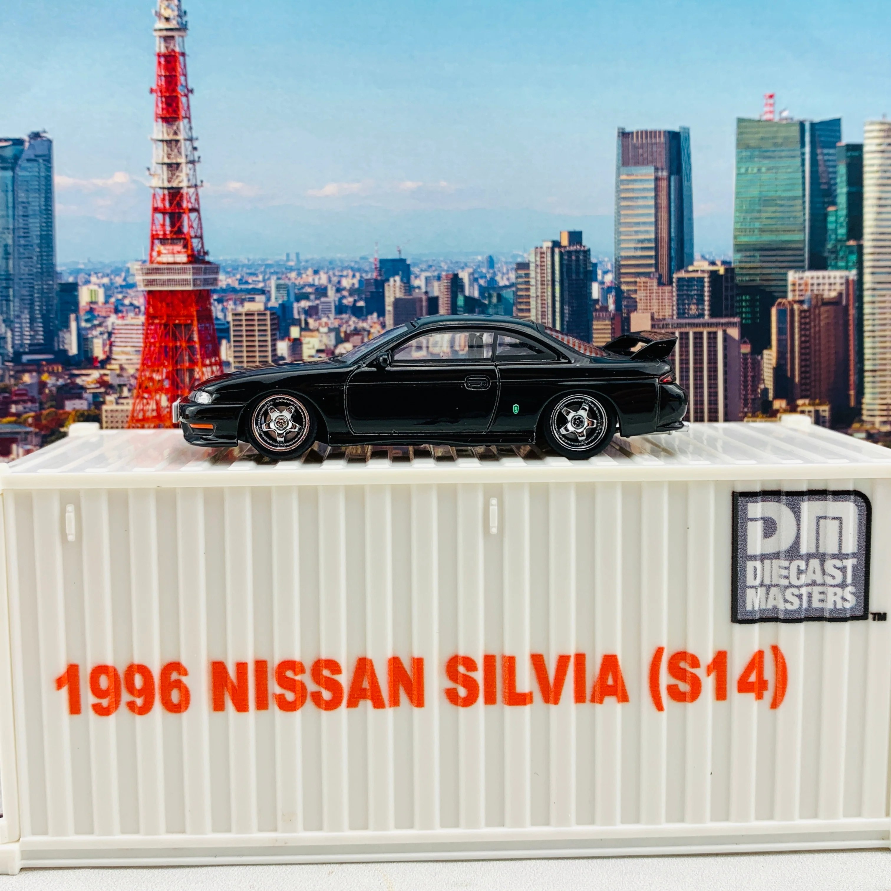 BM Creations JUNIOR 1/64 Nissan Silvia S14 Black RHD with Extra Wheels, Lowering Parts and Container Display 64DM64001 - Image 5