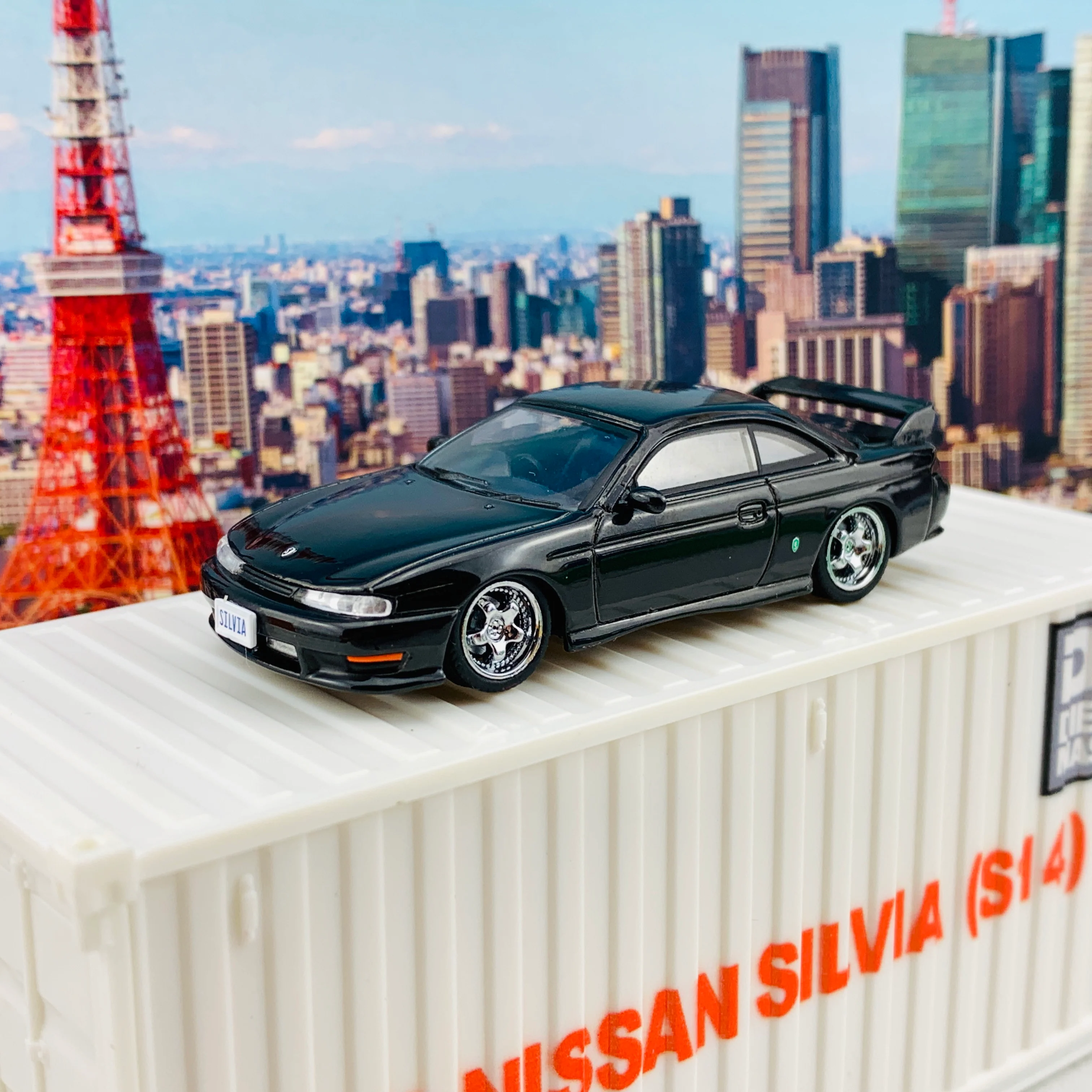 BM Creations JUNIOR 1/64 Nissan Silvia S14 Black RHD with Extra Wheels, Lowering Parts and Container Display 64DM64001 - Image 6