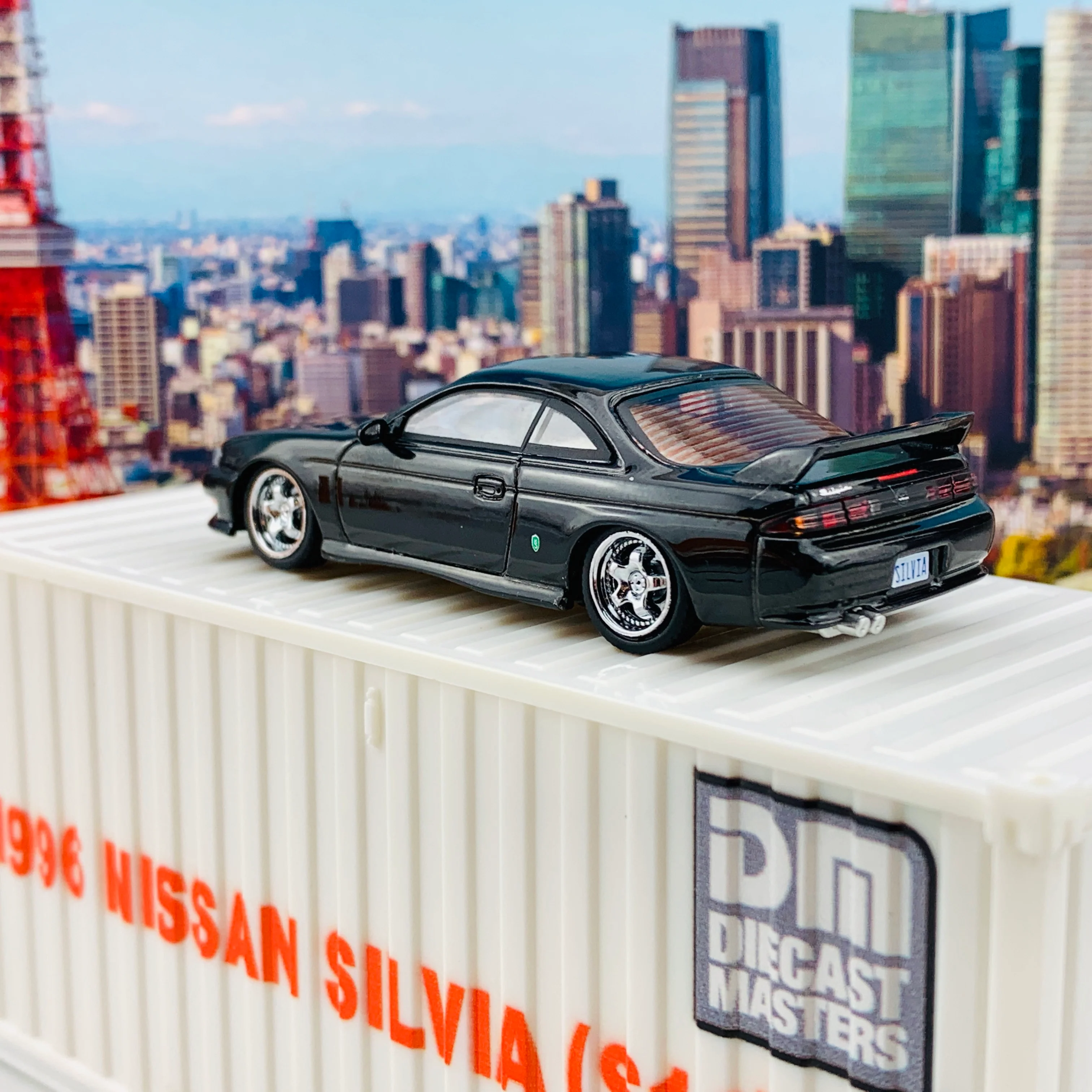 BM Creations JUNIOR 1/64 Nissan Silvia S14 Black RHD with Extra Wheels, Lowering Parts and Container Display 64DM64001 - Image 7