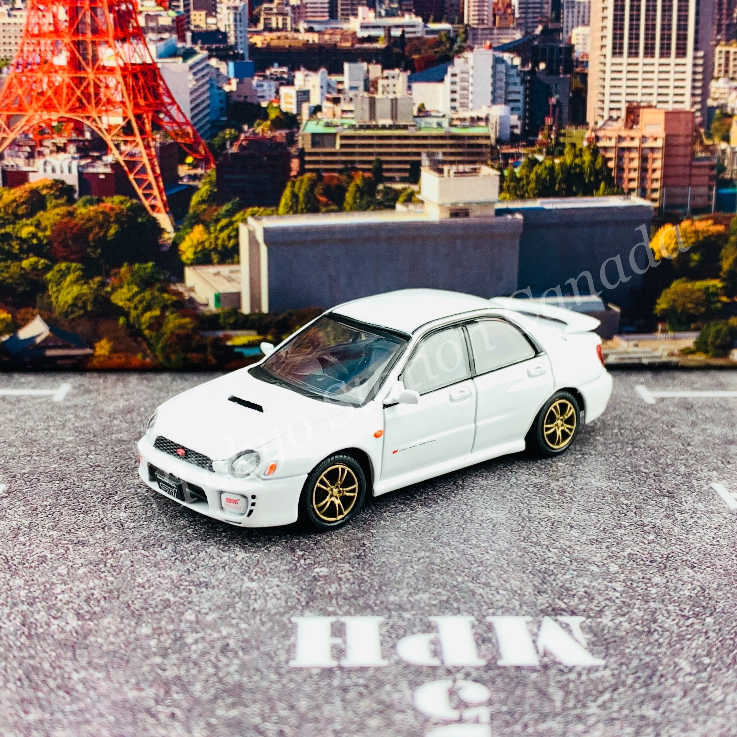 BM CREATIONS JUNIOR 1/64 Subaru Impreza WRX STi 2001 WHITE RHD with Extra Wheel Set and Lowering Parts 64B0082 - Image 2