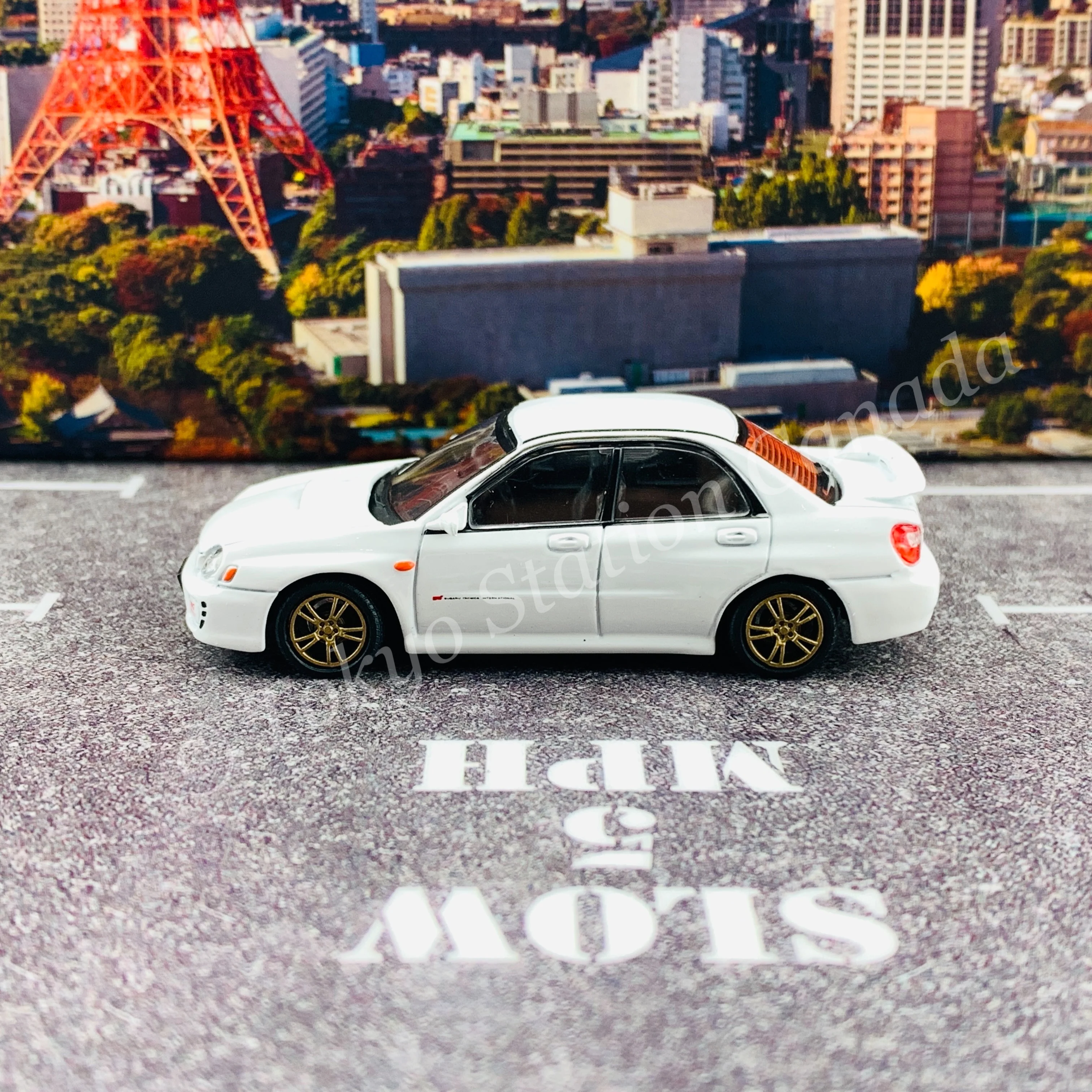 BM CREATIONS JUNIOR 1/64 Subaru Impreza WRX STi 2001 WHITE RHD with Extra Wheel Set and Lowering Parts 64B0082 - Image 3