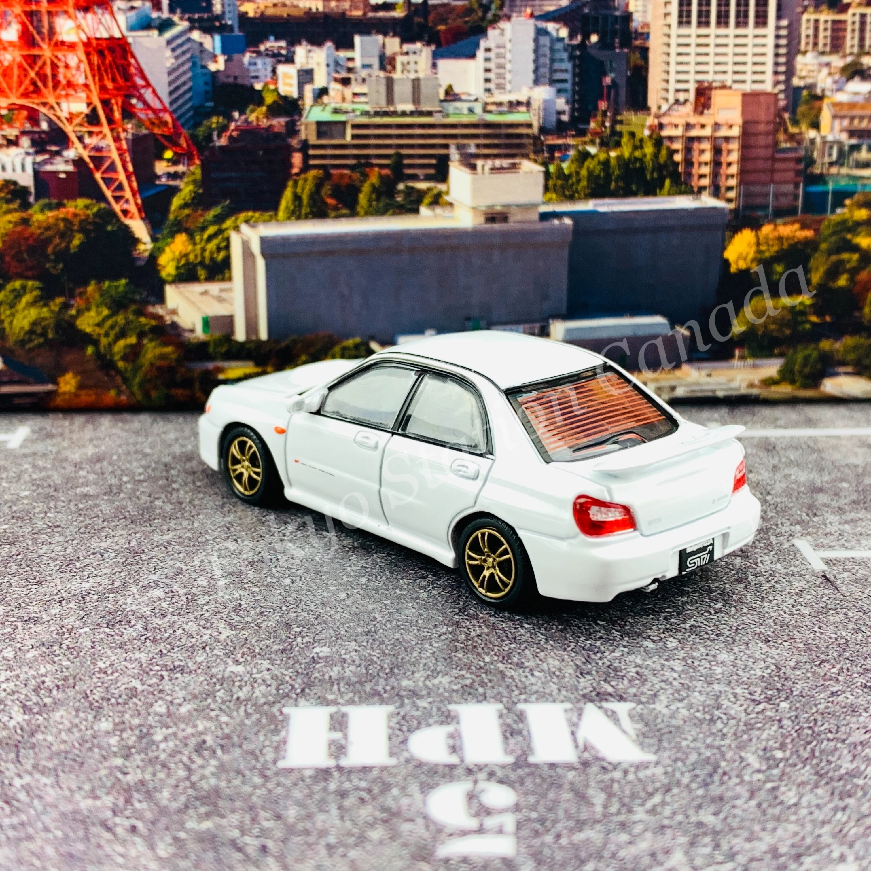 BM CREATIONS JUNIOR 1/64 Subaru Impreza WRX STi 2001 WHITE RHD with Extra Wheel Set and Lowering Parts 64B0082 - Image 4
