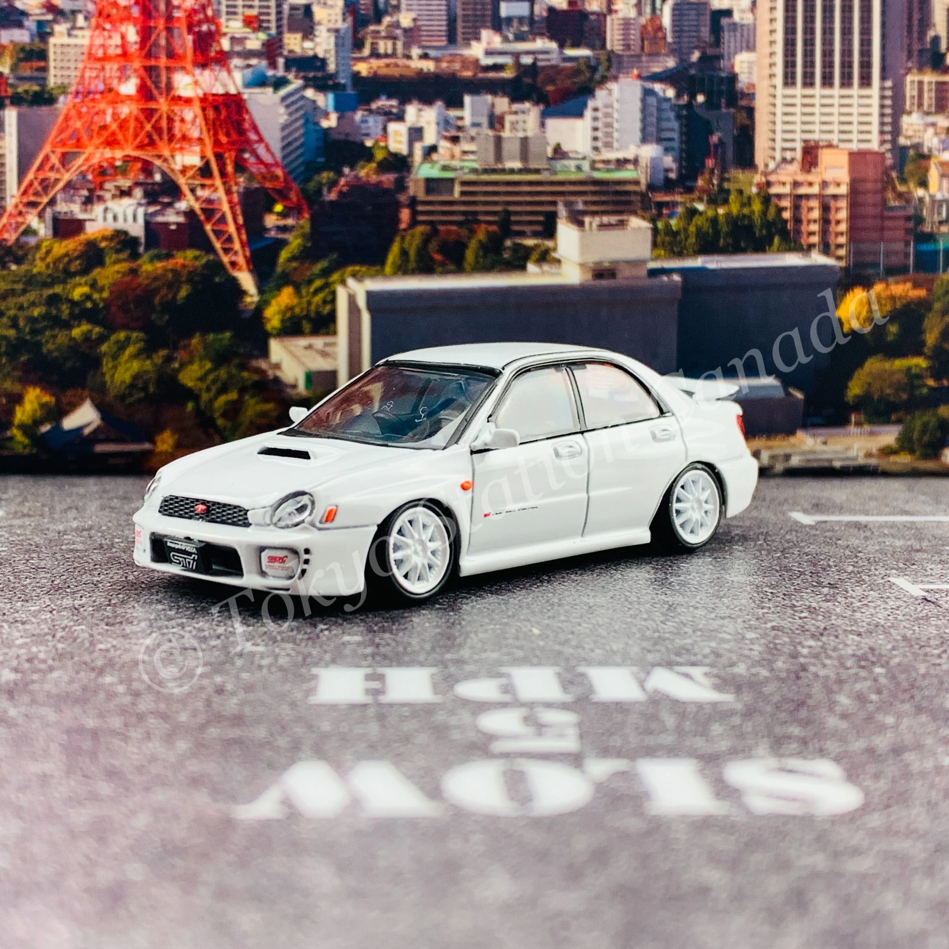 BM CREATIONS JUNIOR 1/64 Subaru Impreza WRX STi 2001 WHITE RHD with Extra Wheel Set and Lowering Parts 64B0082 - Image 7