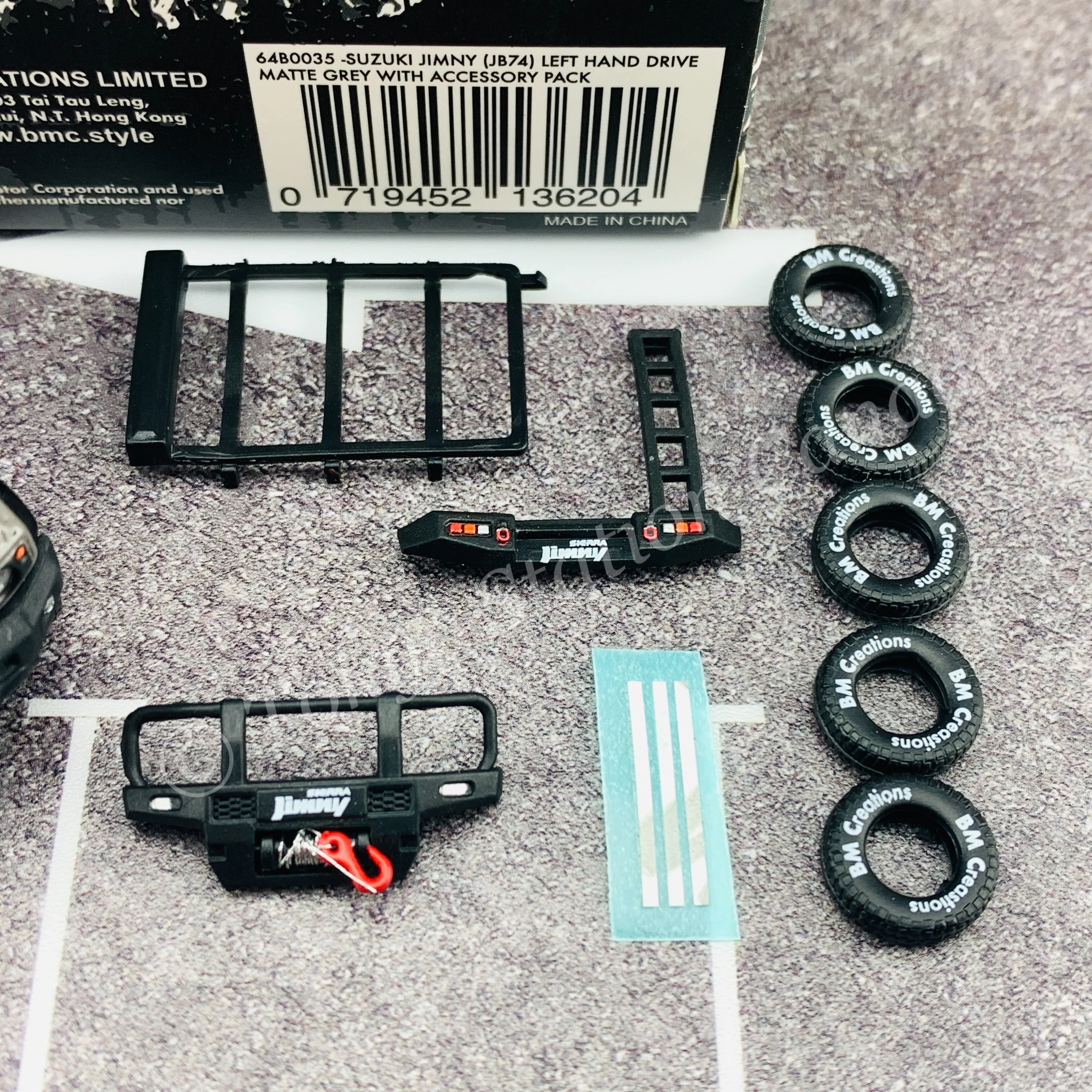 BM CREATIONS JUNIOR 1/64 Suzuki Jimny SIERRA JB74 with Accessory Pack Matt Grey LHD 64B0035 - Image 3