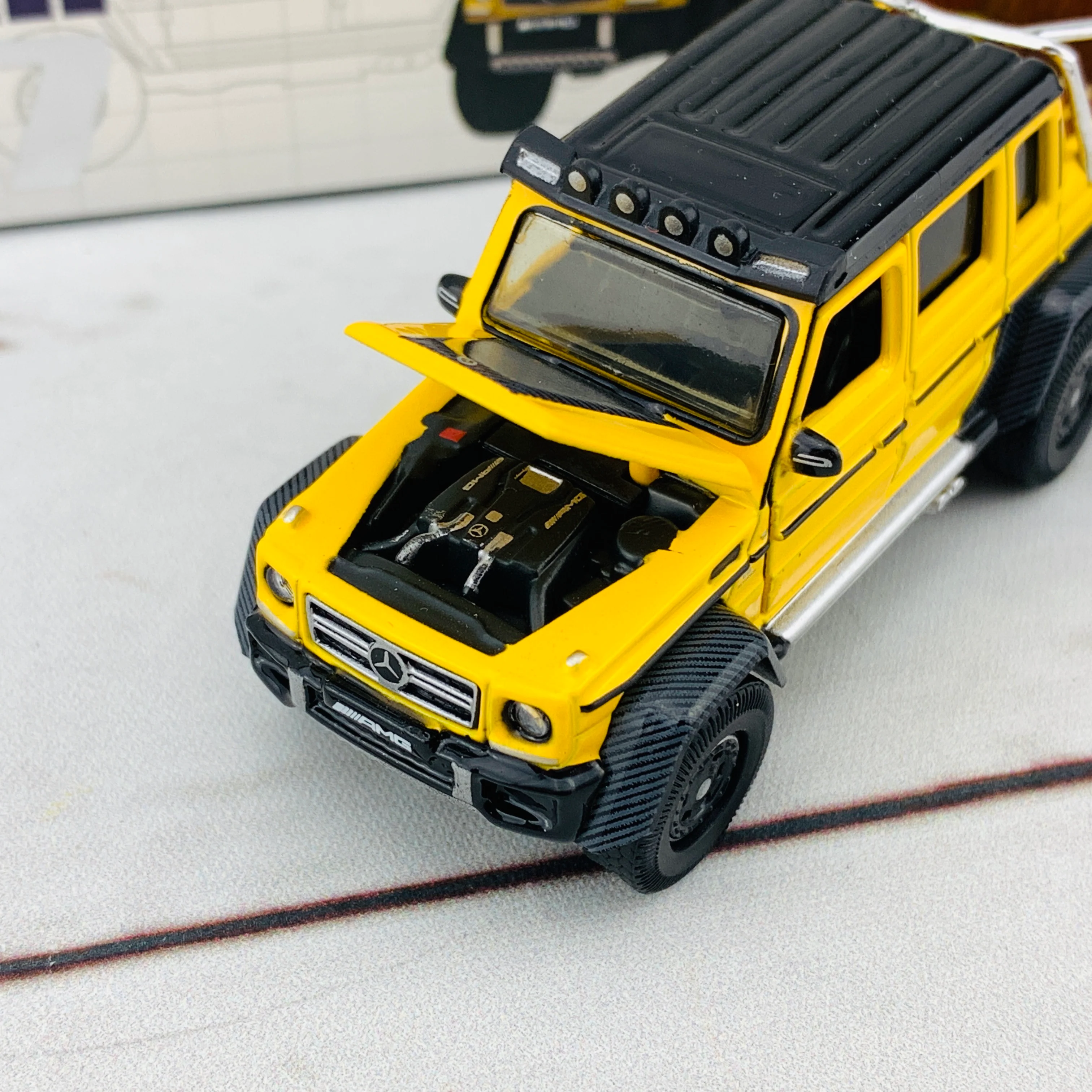 ERA CAR 07 1/64 Mercedes Benz G63 AMG 6x6 Spotlight Yellow MB196X6RN07 - Image 4