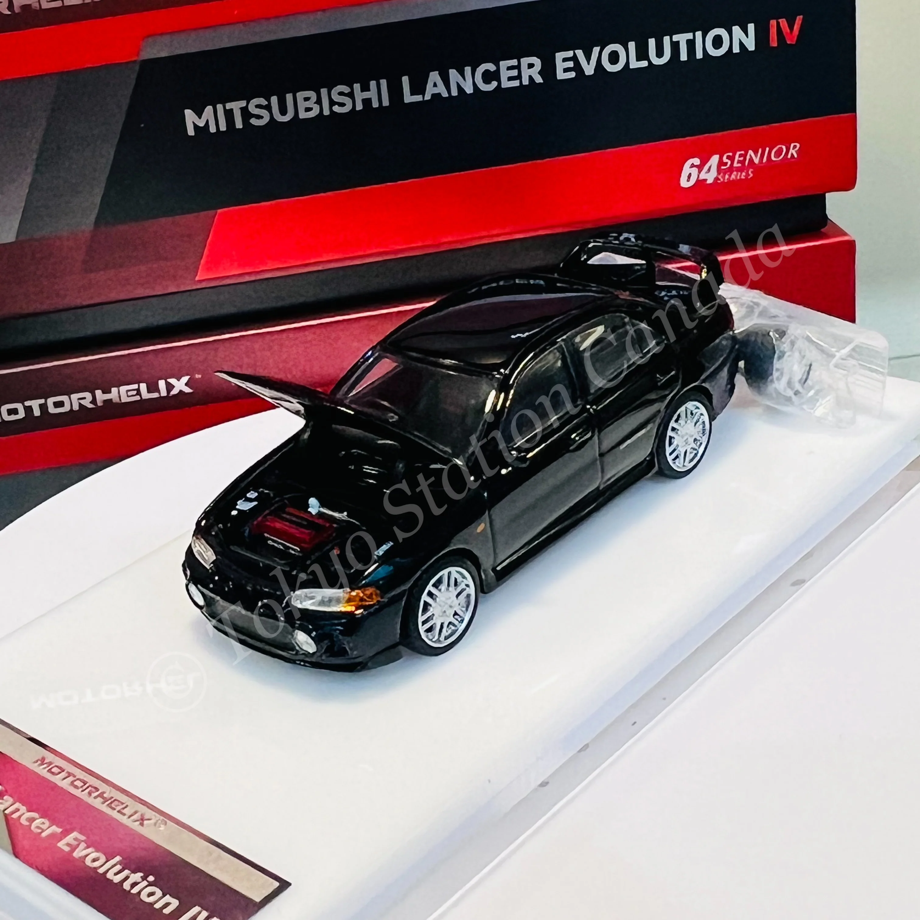 MOTORHELIX 64SENIOR SERIES 1/64 Mitsubishi Lancer Evolution IV Black M64004 - Image 2