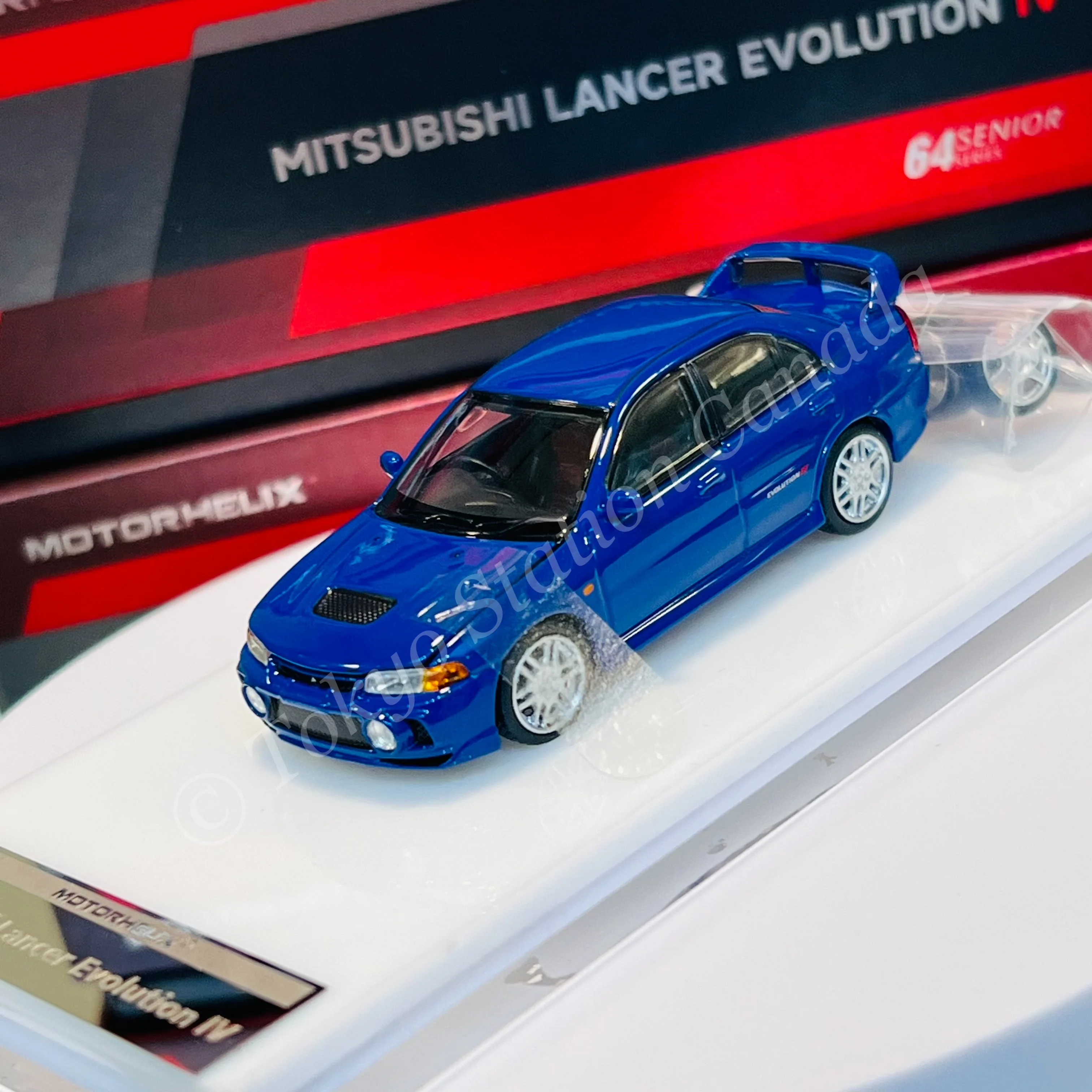 MOTORHELIX 64SENIOR SERIES 1/64 Mitsubishi Lancer Evolution IV Icelle Blue M64002 - Image 2
