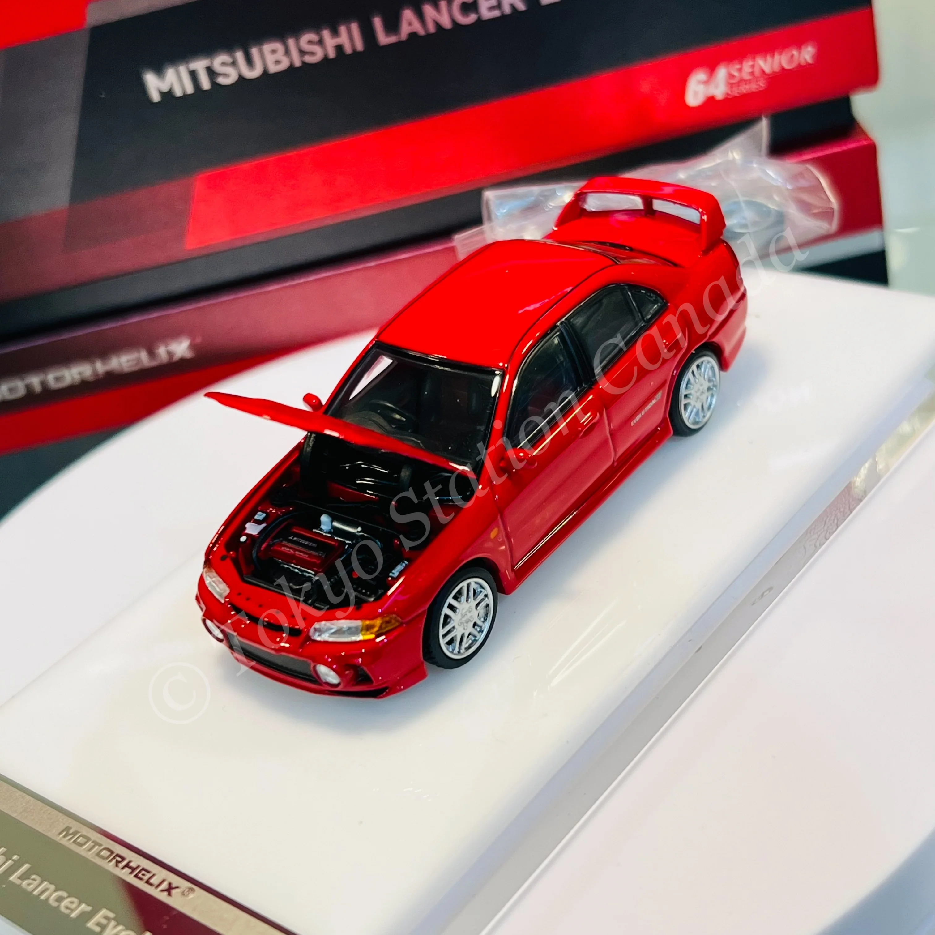 MOTORHELIX 64SENIOR SERIES 1/64 Mitsubishi Lancer Evolution IV Red M64008 - Image 3