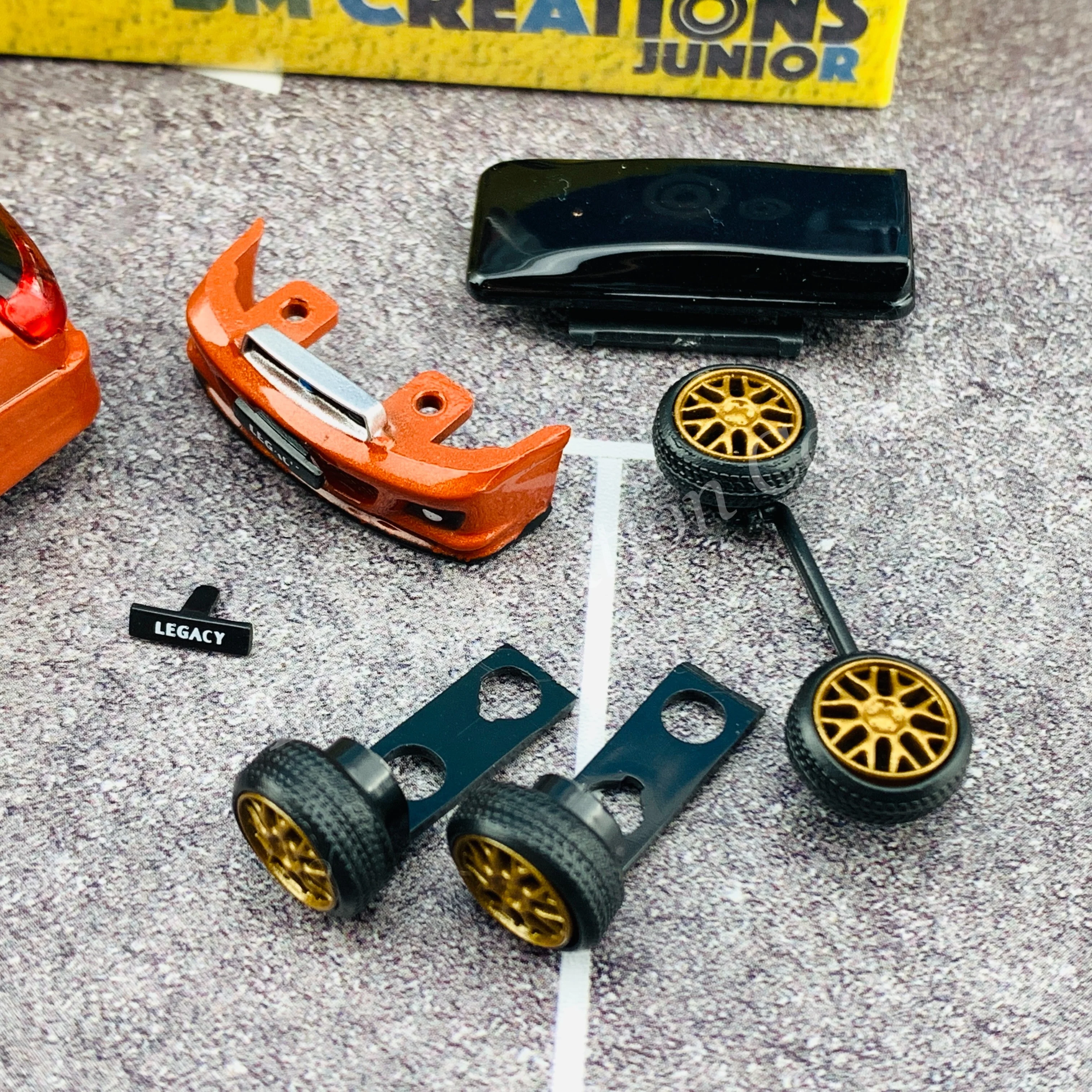 BM Creations JUNIOR 1/64Subaru 2002 Legacy E-tune II ORANGE RHD with Extra Wheels, Lowering Parts 64B0152 - Image 2