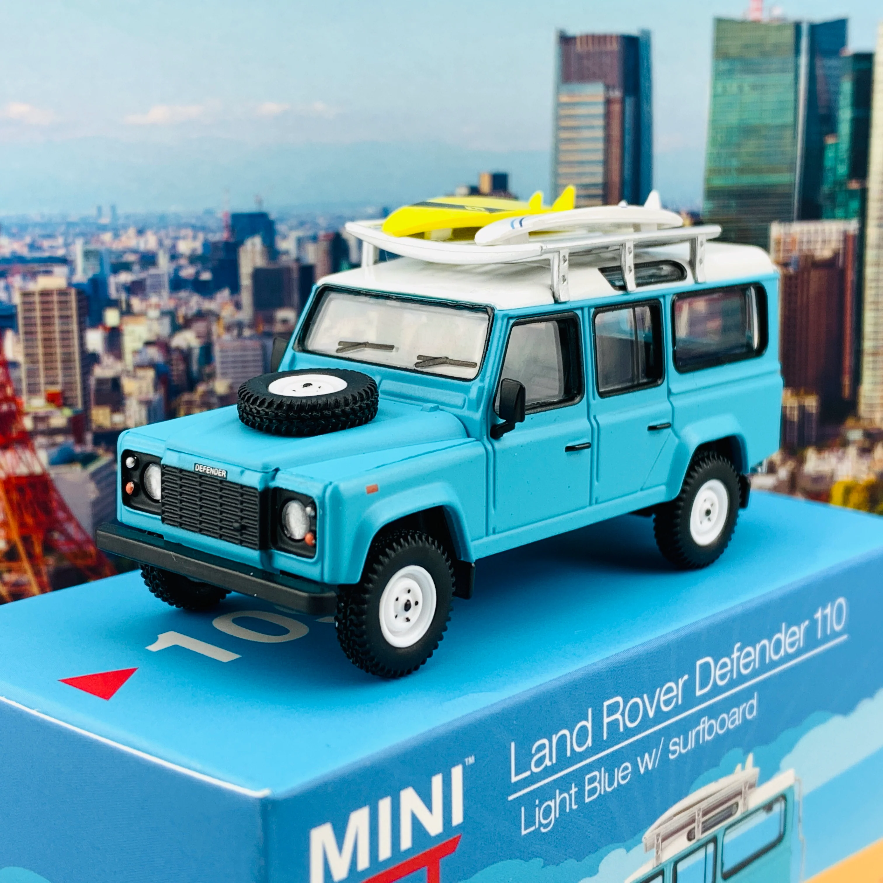 MINI GT 1/64 Land Rover Defender 110  Light Blue w/ Surfboard RHD MGT000109-R - Image 3