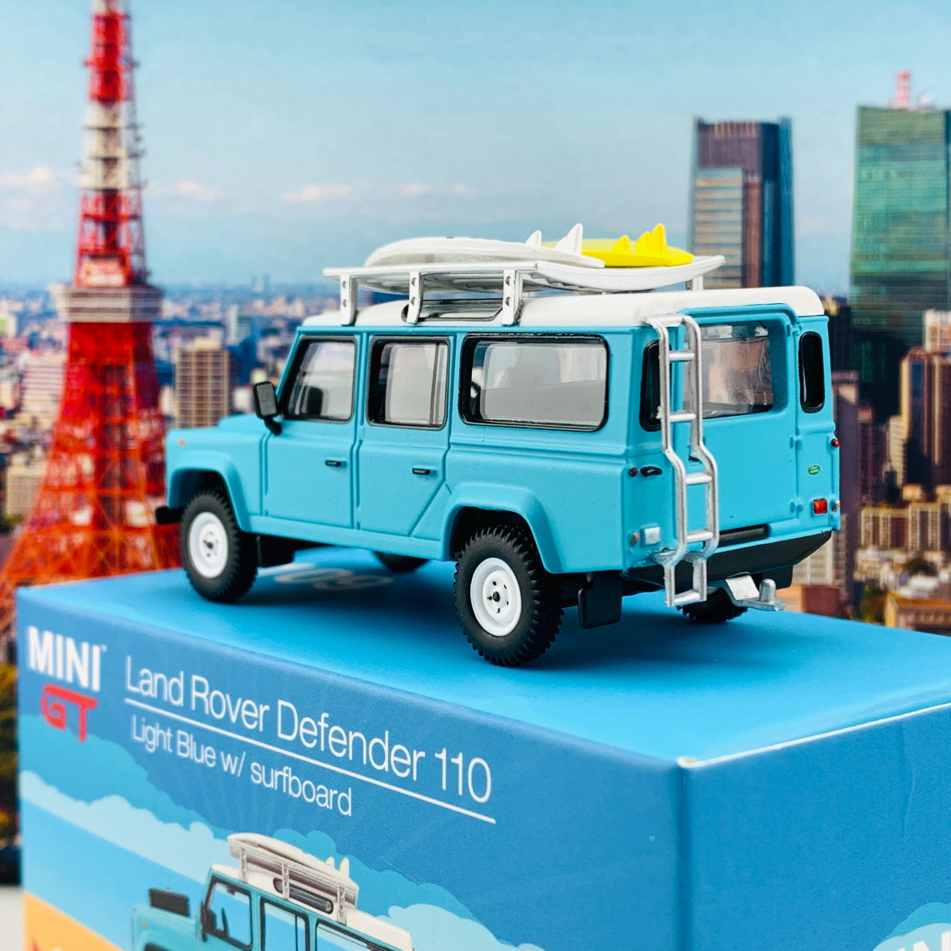 MINI GT 1/64 Land Rover Defender 110  Light Blue w/ Surfboard RHD MGT000109-R - Image 4