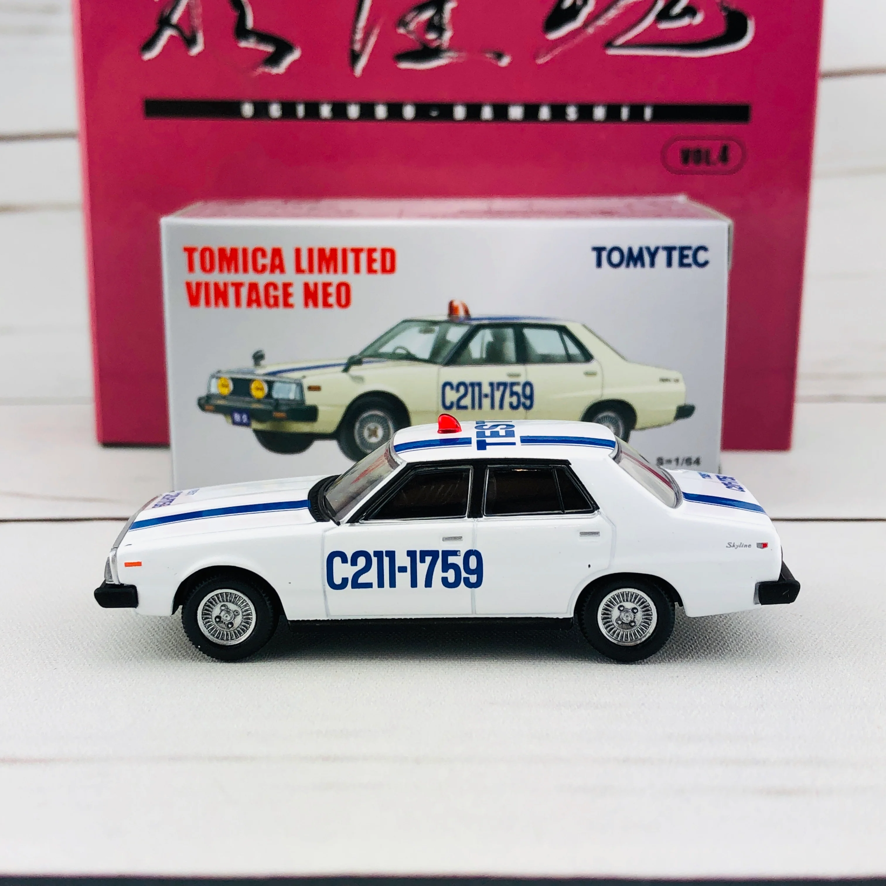 Tomica Limited Vintage 1/64 Nissan Skyline 2000 Turbo GT-E.S TEST CAR (1980) OGIKUBO-DAMASHII Vol.4 - Image 2