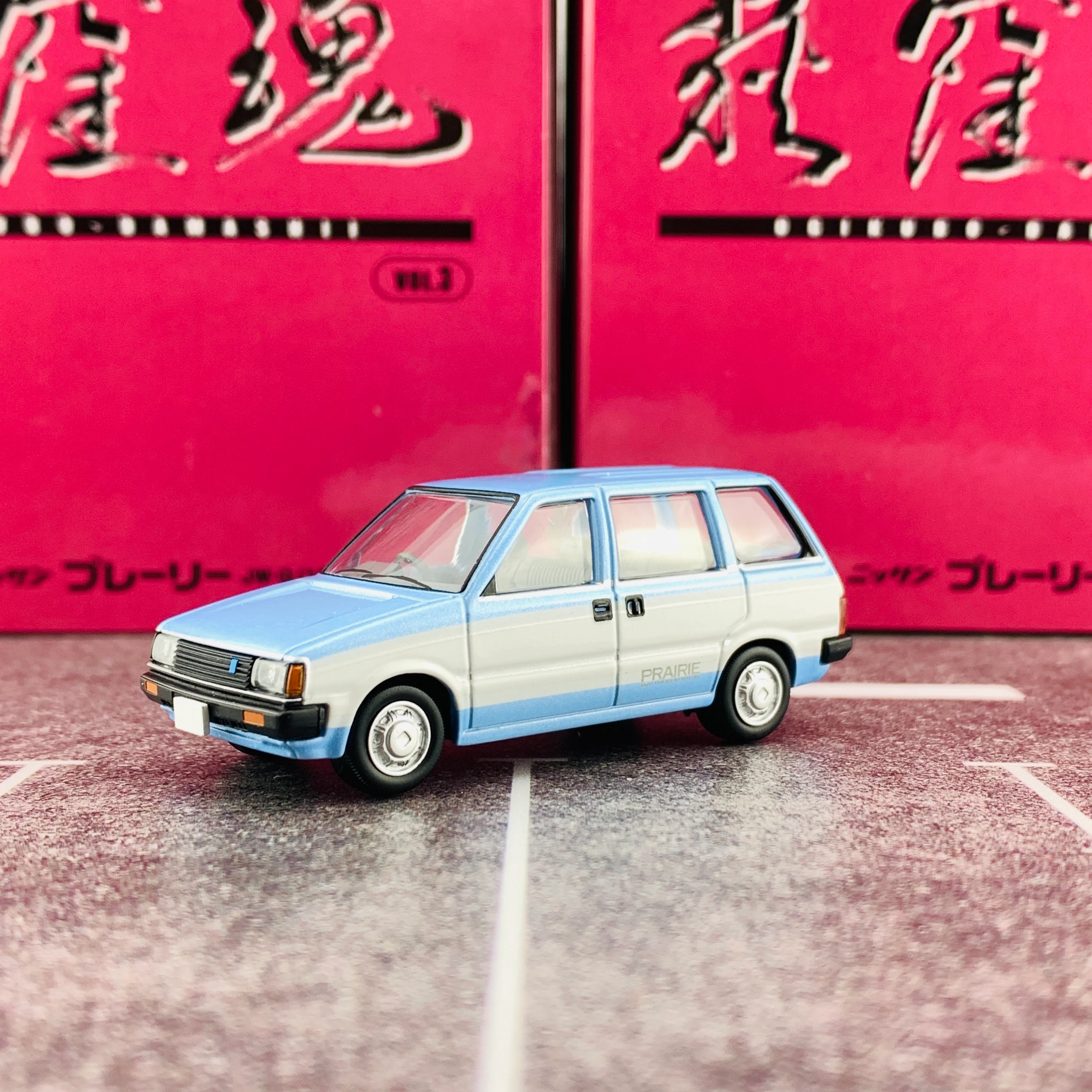 Tomica Limited Vintage Neo 1/64 Ogikubo Damasii Nissan Prairie JW-G (Year 1982) - Image 2